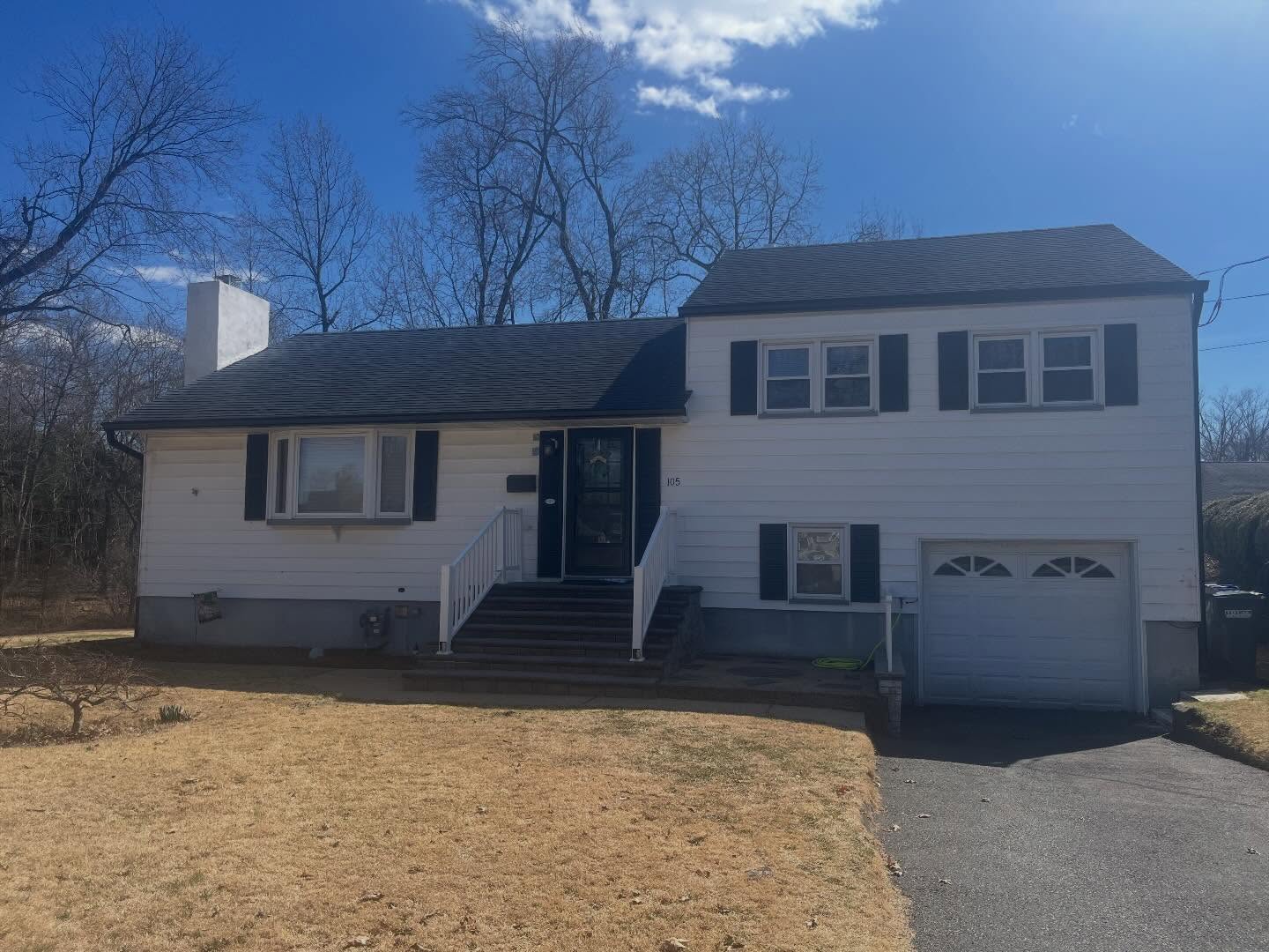 After — new black seamless gutters installed by Dynamic Home Improvements