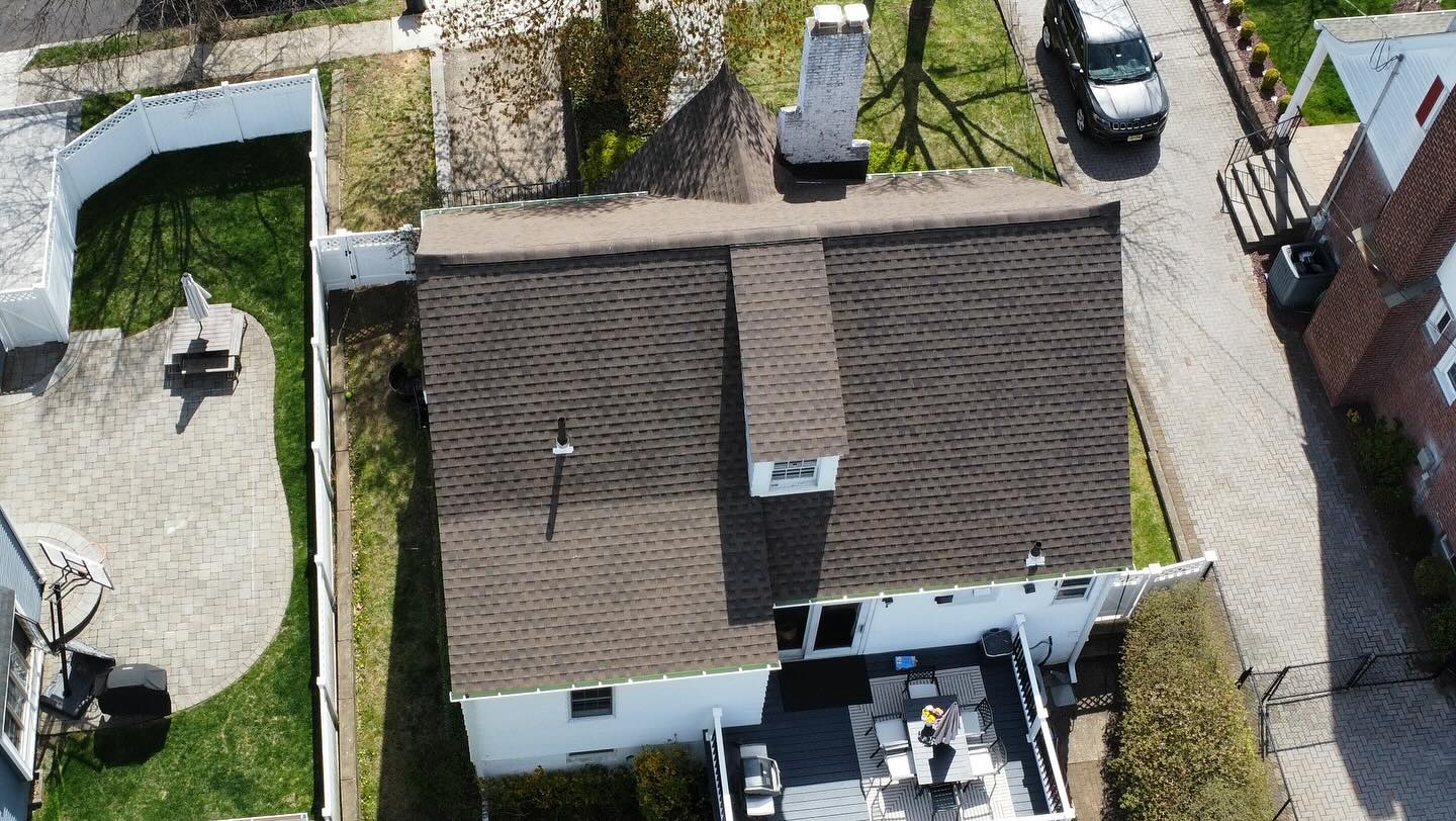 Overhead drone view of the same Maywood NJ home with a new GAF Timberline HDZ Barkwood shingle roof